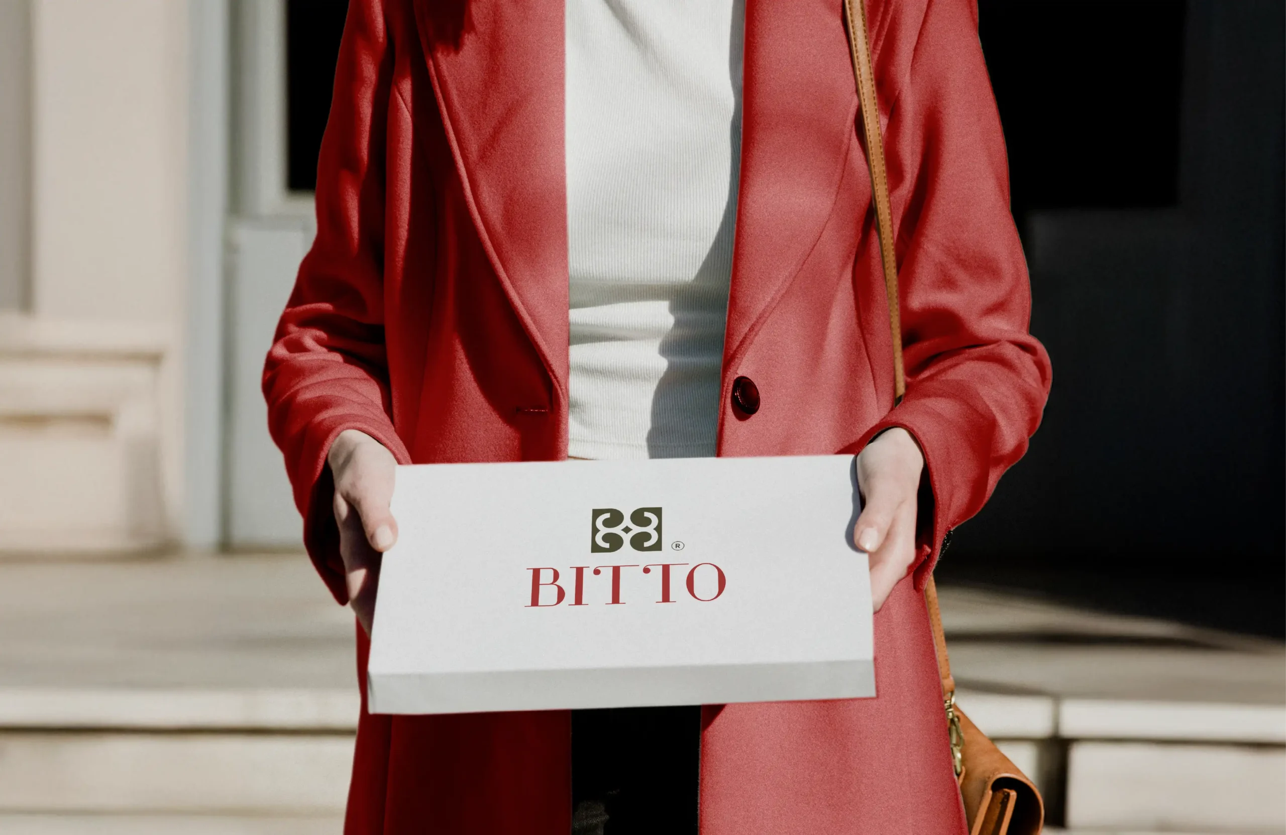 BITTO luxury fashion brand packaging box held by model showcasing premium logo design