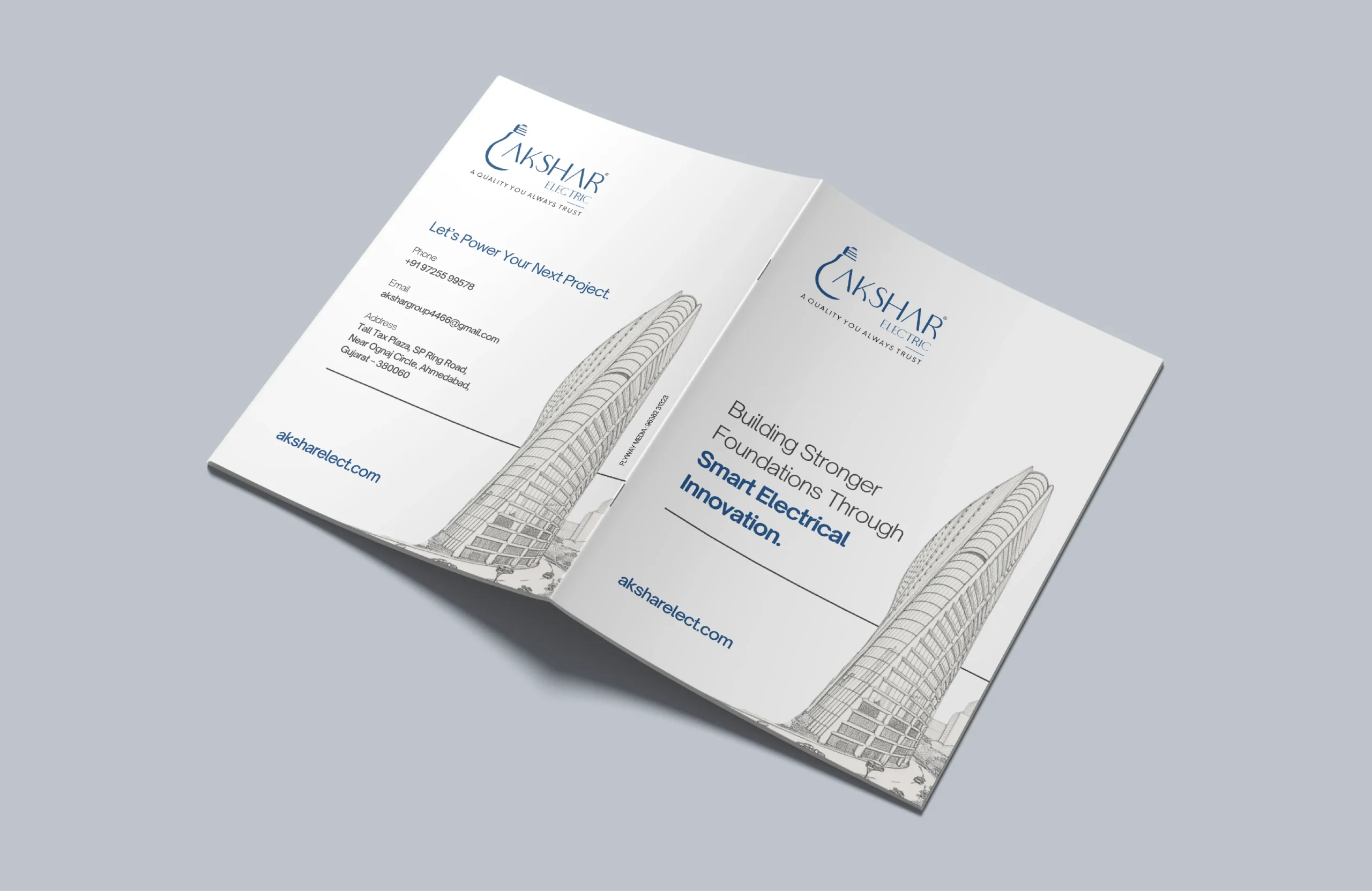 Corporate brochure cover design for Akshar Electric with blue branding, clean typography, and architectural line illustration.