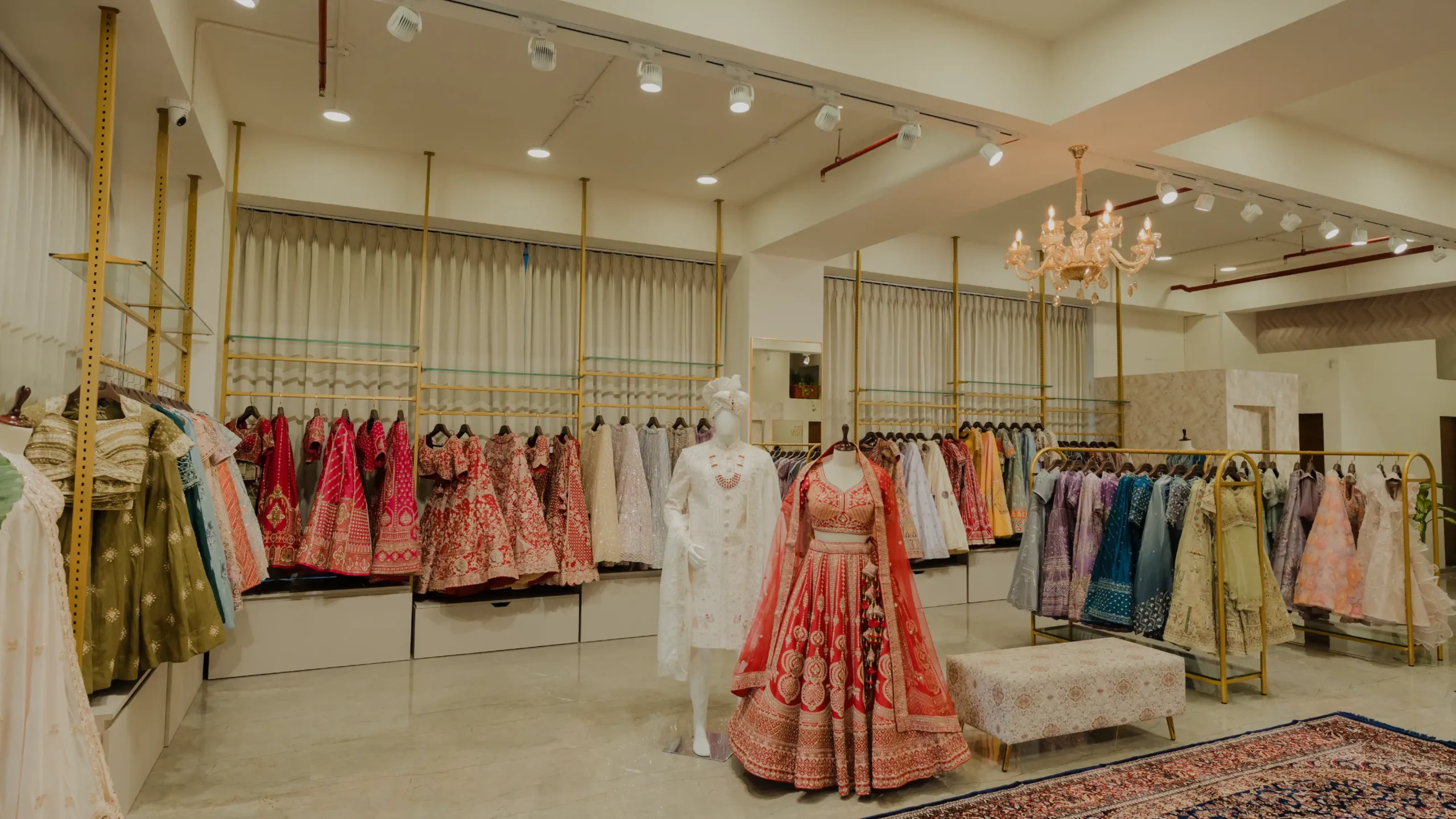 House Of Vastra Nikol Branch bridal showroom with bridal lehenga display, mannequin styling, chandelier, and premium ethnic fashion interiors
