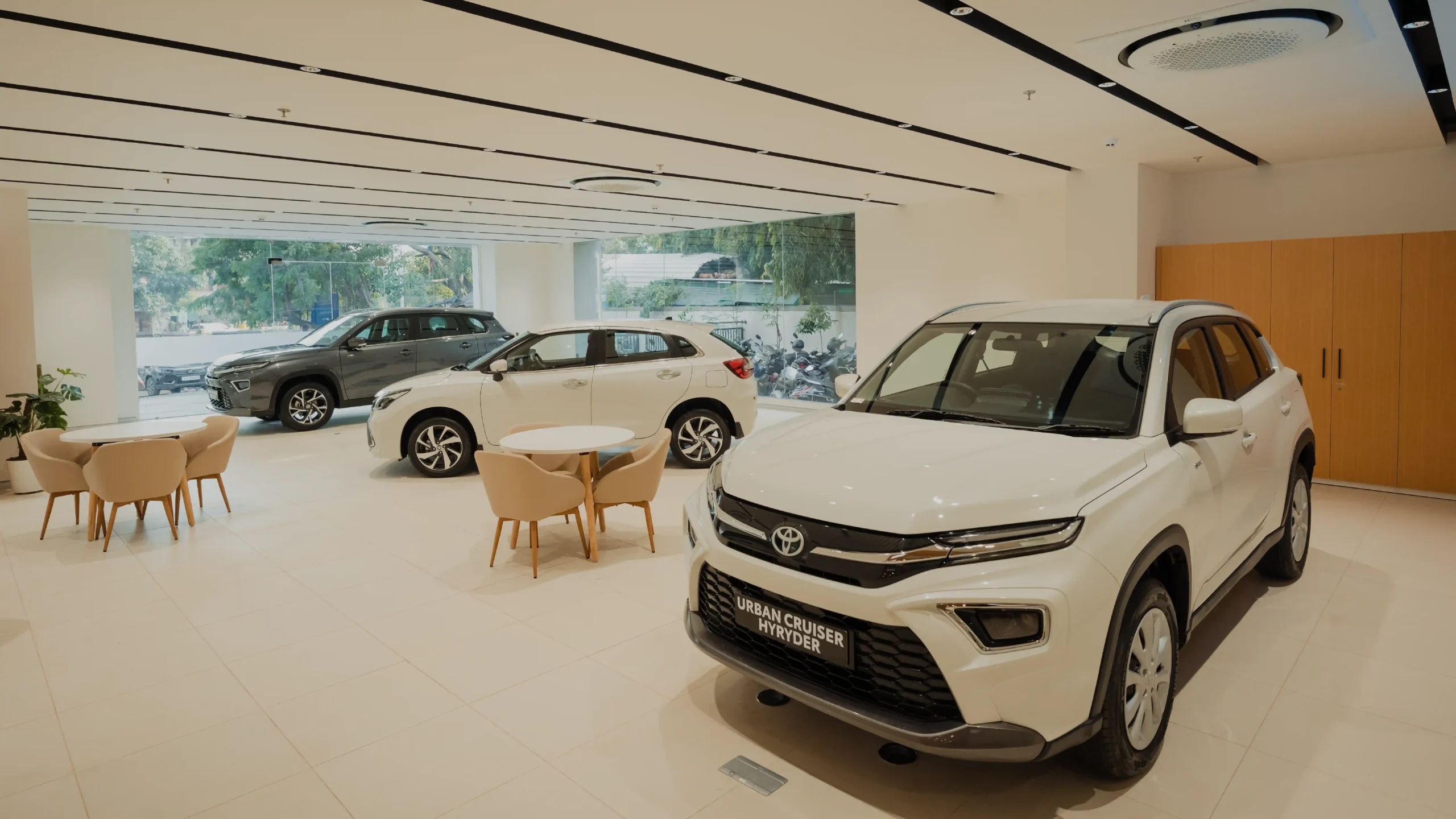 Elegant conference room at Shreeji Toyota showroom with premium meeting table, executive chairs, and modern corporate interior