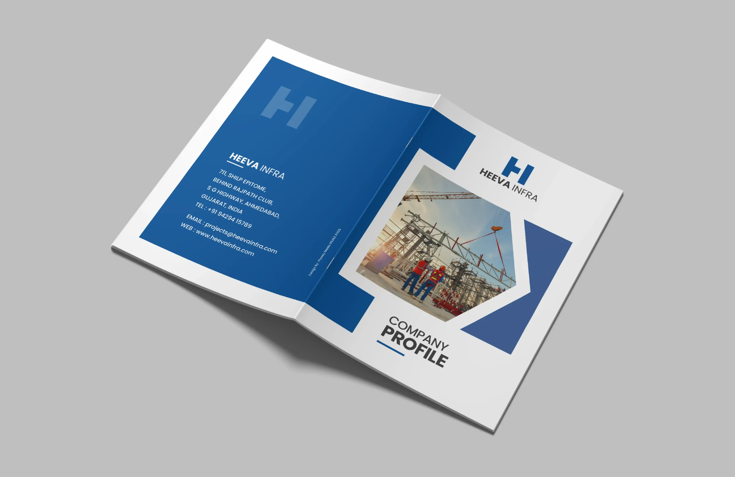 Corporate brochure cover design for Heeva Infra featuring blue branding, infrastructure imagery, and a clean company profile layout.