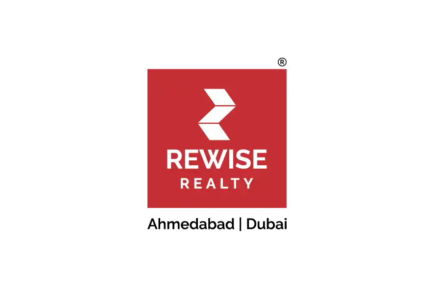 Rewise Realty logo on red square background with white text