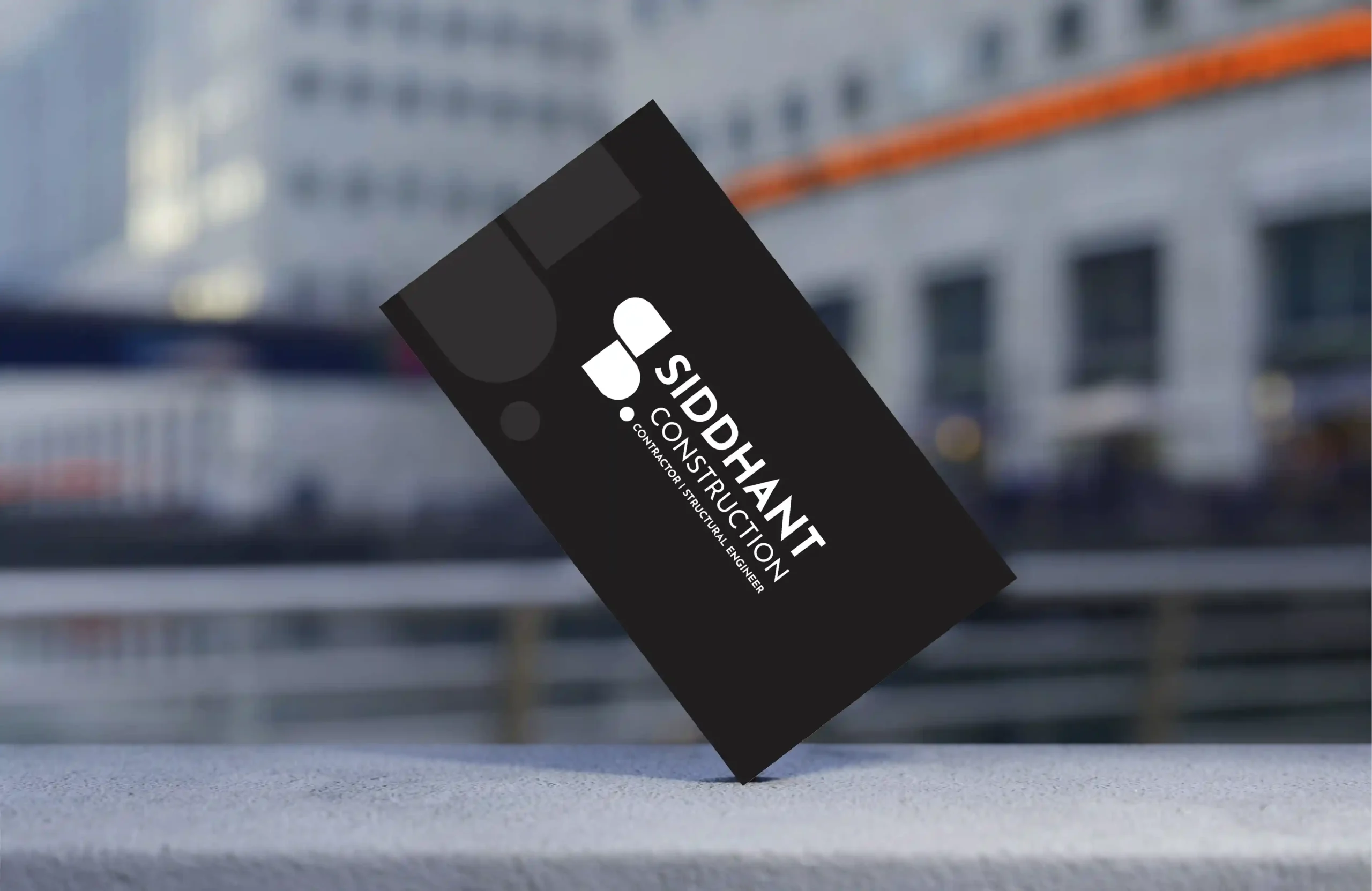 Black business card mockup with Siddhant Construction logo for contractor and structural engineer branding
